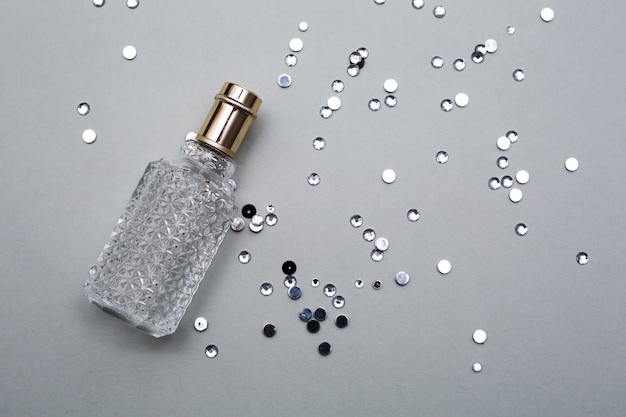 Perfume of female Bottle over grey background