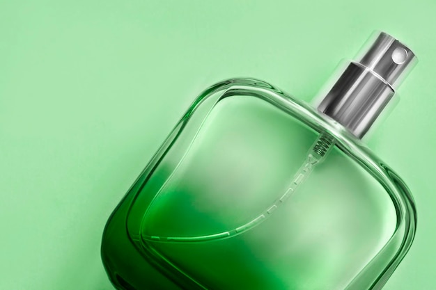perfume on green background