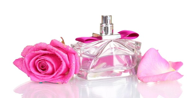 Perfume and pink roses on white background