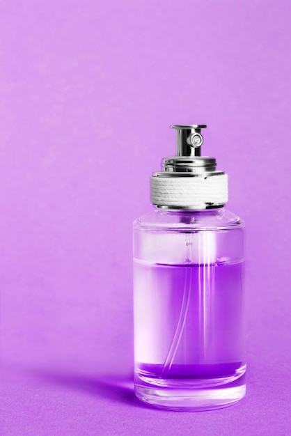 perfume on violet background