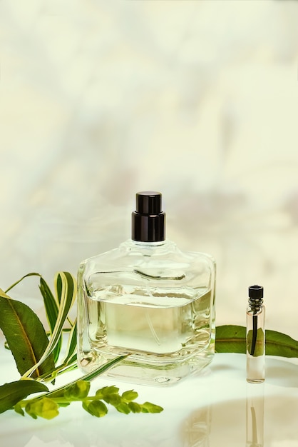 Perfumery in a spray bottle on green