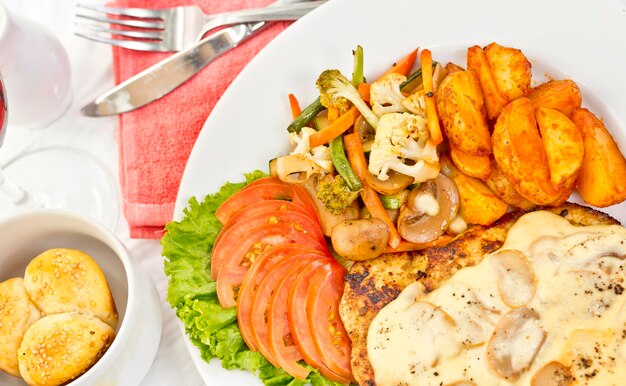 Peri peri Chicken with Button mushroom gravy Saute Vegetables Spicy fried Potatoes with Tomato Lettuce Salad