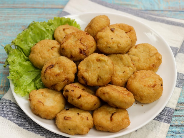 Perkedel tahu or fried tofu patties. Made of mixture; mashed tofu, small amount of tapioca flour