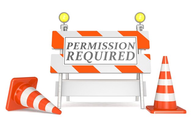 Photo permission required sign on barricade and traffic cones