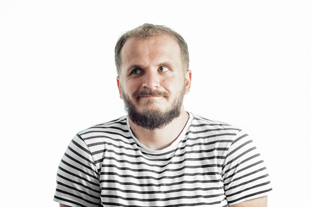 Perplexity bearded man in a striped T-shirt looking away. 30-35 years old. Isolated on white.