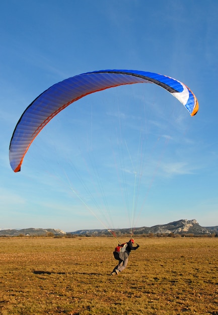 Perrson trying paragliding