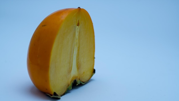 persimmon fruit in a cut on a white background