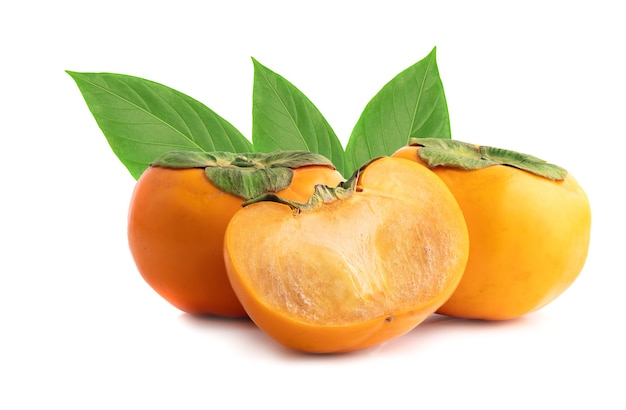 Persimmon fruit with cut in half isolated on white background