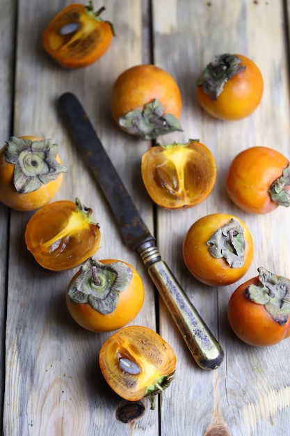 persimmon on a wooden surface.