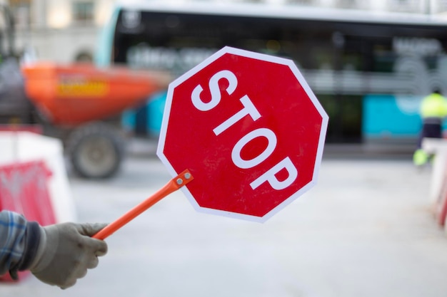 Photo person directing the traffic for works