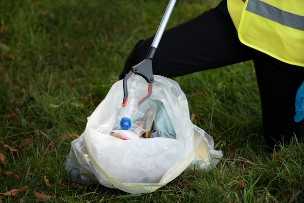 person doing community service by collecting trash