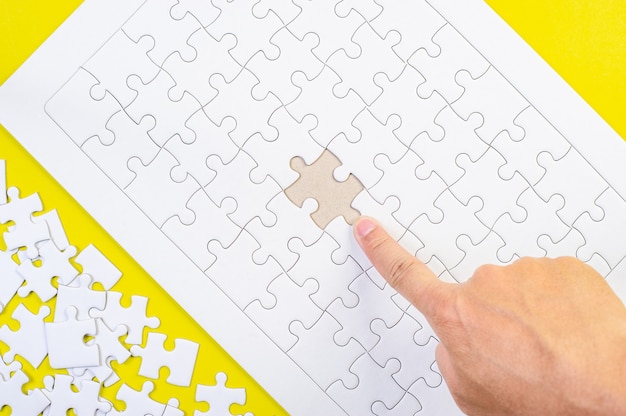 Person doing jigsaw puzzle