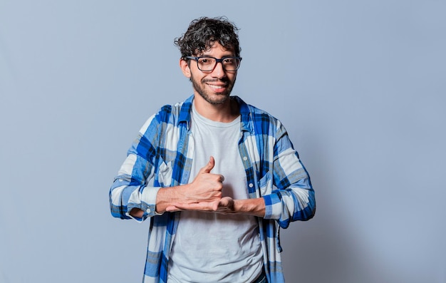 Person gesturing help with hands in sign language young man\
showing help gesture with hands in sign language interpreter man\
gesturing help with hands in sign language