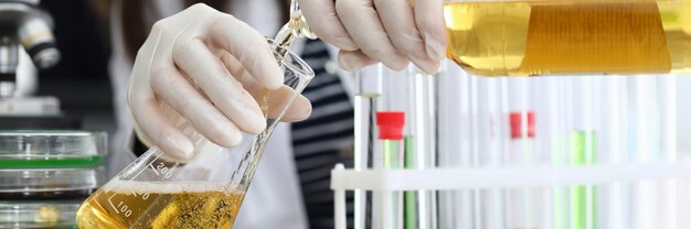 Person and glassware on table