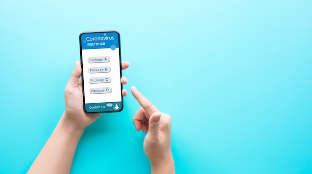 Photo person hand using smartphone for choosing coronavirus insurance package before go travel.health and financial management