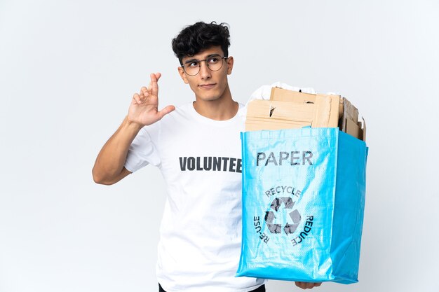 Person holding a bag to recycle