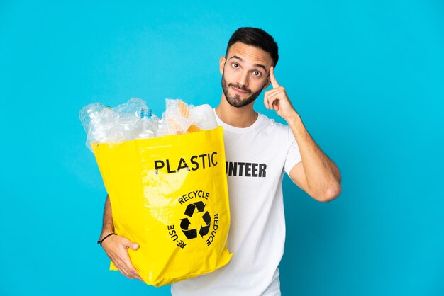 Person holding a bag to recycle