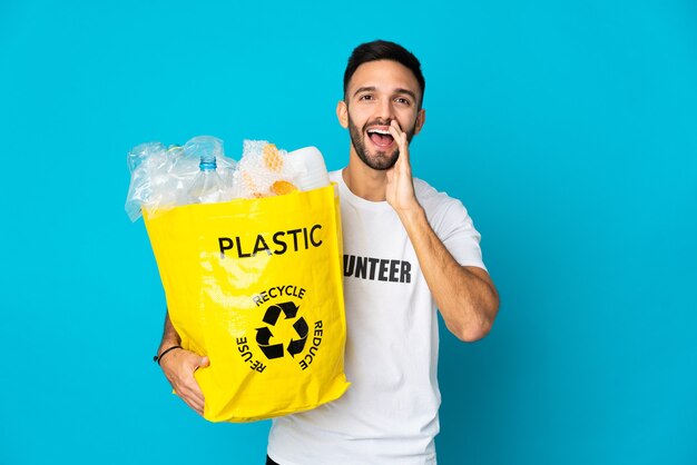 Person holding a bag to recycle