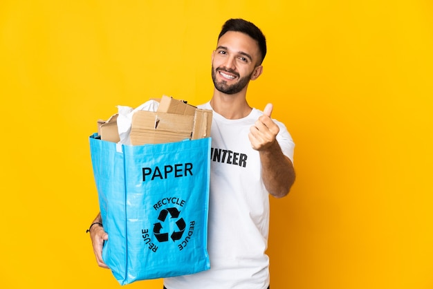 Person holding a bag to recycle