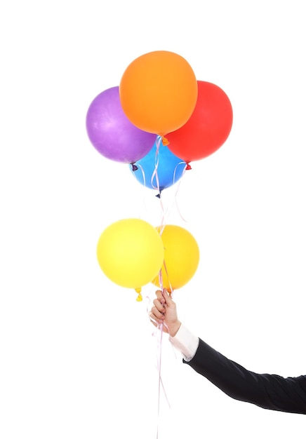 Photo person holding balloons against white background