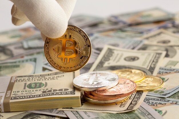 Photo person holding bitcoin in fingers