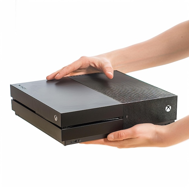 Photo a person holding a black xbox 360 console in their hands