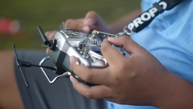 Photo a person holding a drone with the pro camera on it