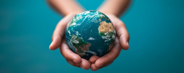 a person holding a globe with the words earth on it