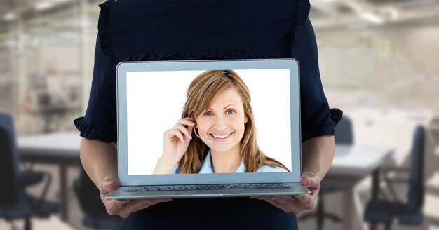 Person holding a laptop, having a video meeting and interacting\
online with caucasian woman wearing headphones, social distancing\
and self isolation during lockdown.