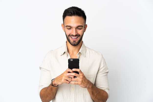 Person holding a mobile over isolated background