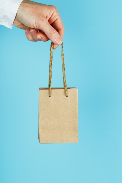 Person holding paper bag