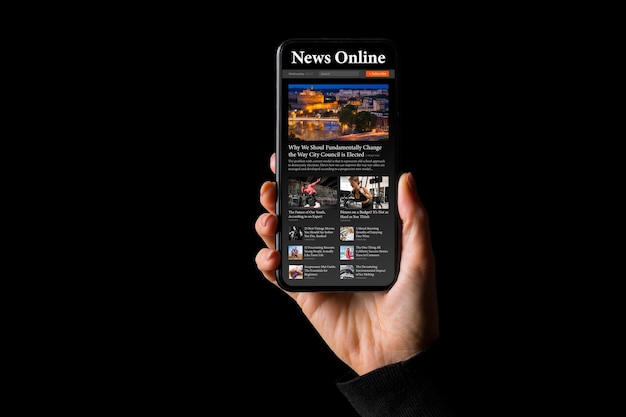 Person holding phone in hand with sample news website on the\
screen