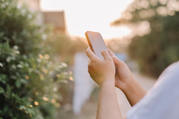 A person holding a phone in their hands