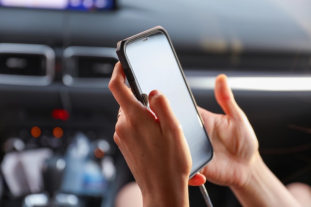 A person holding a phone with a screen that says " t " on it.