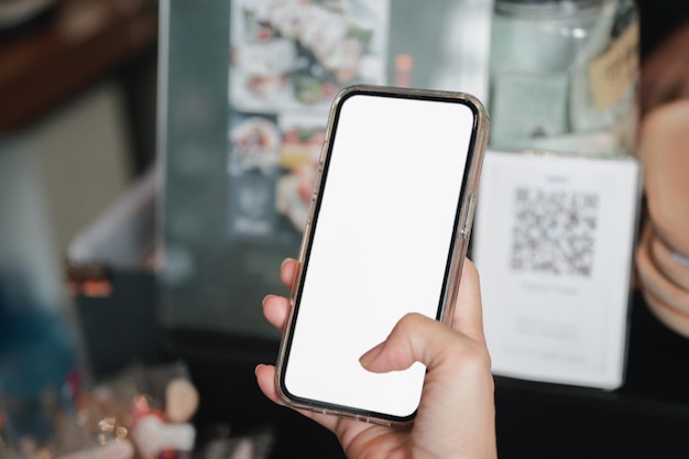 A person holding a phone with a white screen that says'iphone '