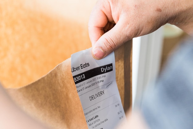 a person holding a receipt that says quot exit quot on it