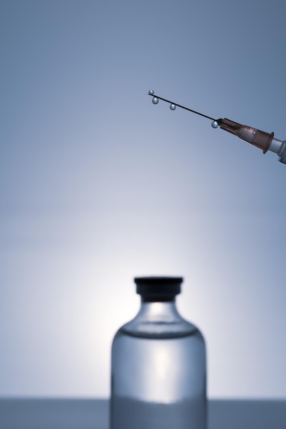 Photo a person holding a syringe that is about to be used to paint a piece of glass