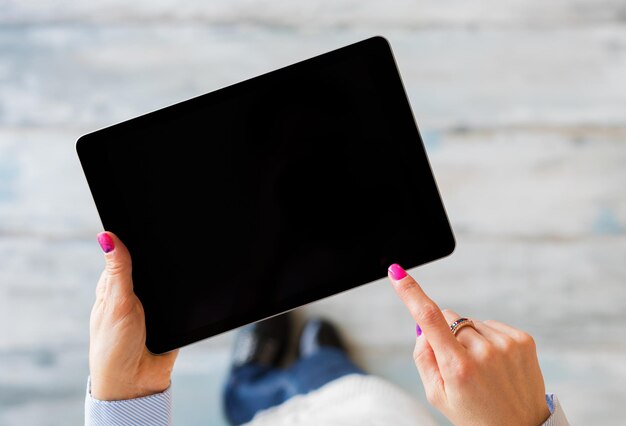 Person Holding Tablet In Hands View From Above