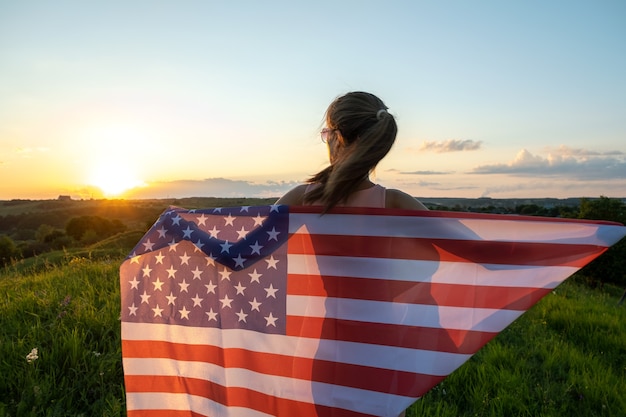 Person holding USA national flag