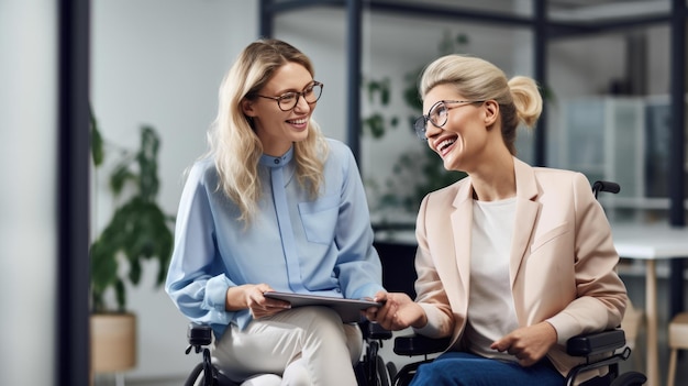 Person i wheelchair having a pleasant conversation with another coworker in the office