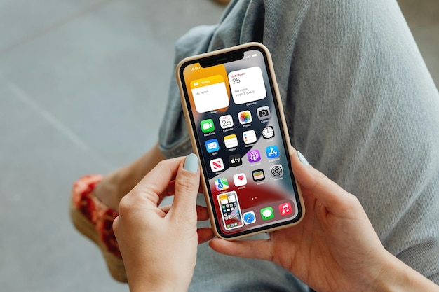A person is holding an iphone UI branding mockup