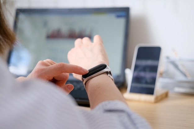 a person is using a smart phone and a monitor