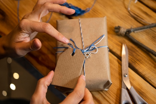 Person making a wrapping paper for a gift