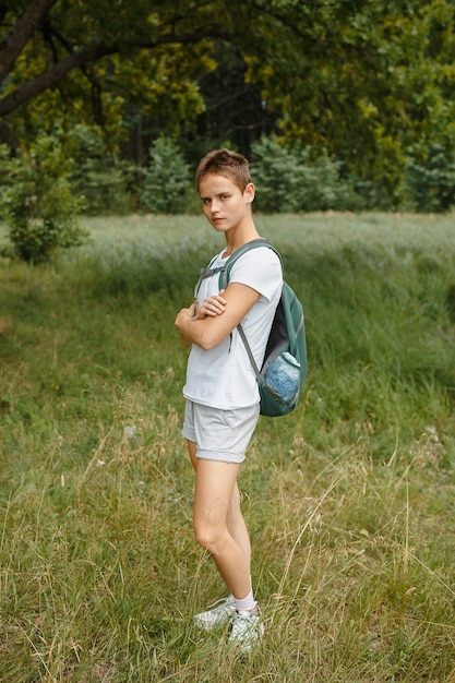 A person in nature, walking in the forest, active recreation