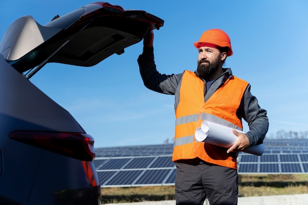 Photo person near alternative energy plant