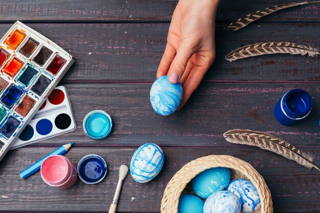 Person painting Easter eggs