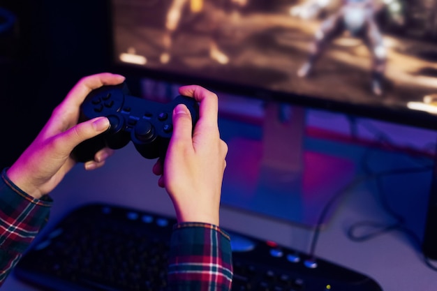 Person Playing Video Game With Controller Cropped