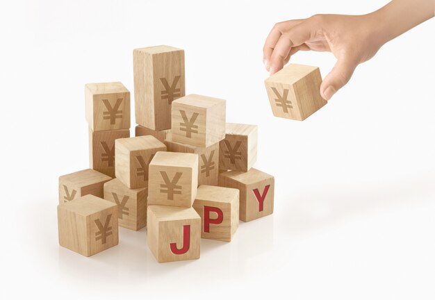 Person playing with wooden to blocks