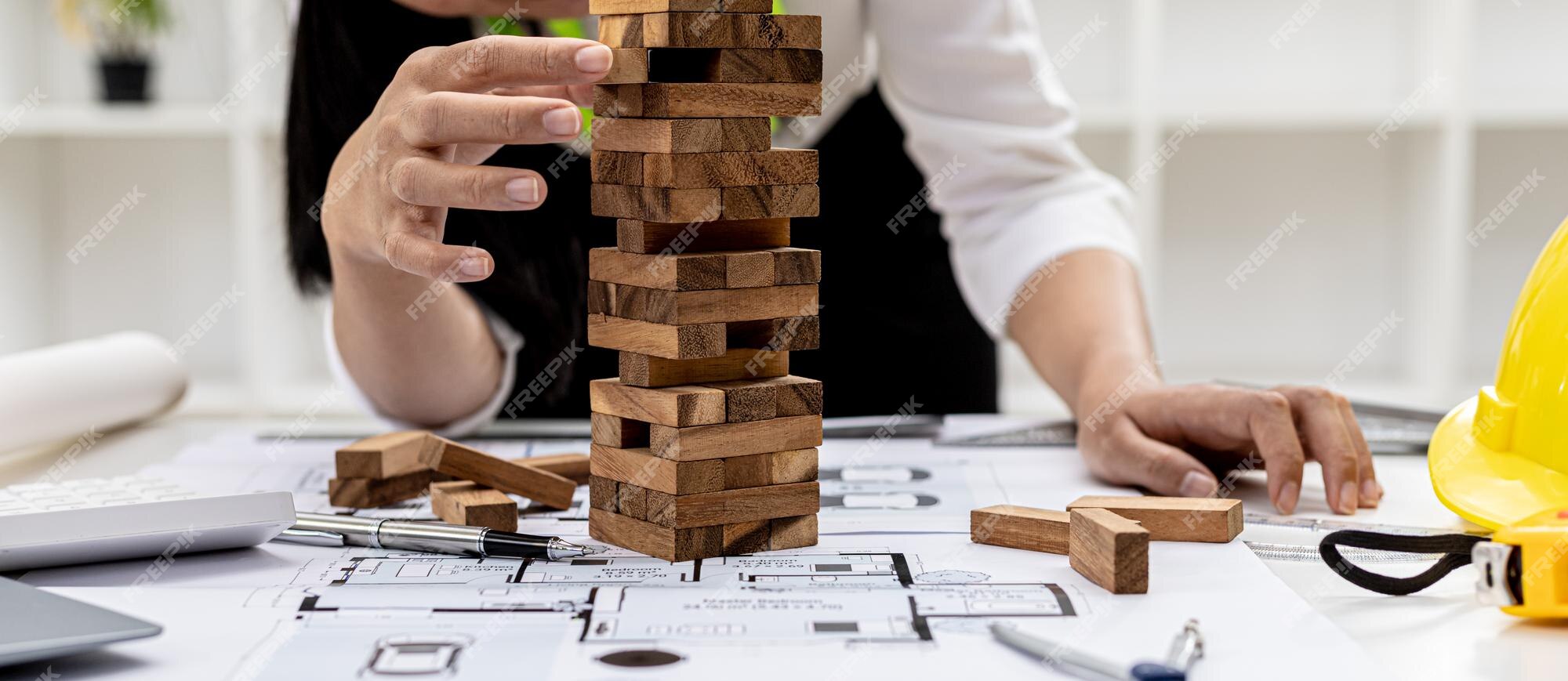 Premium Photo  A person playing a wooden game condo as a floor on