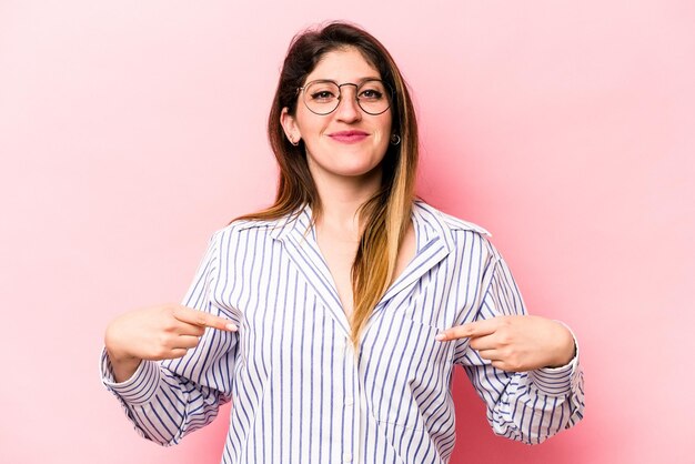 Person pointing by hand to a shirt copy space proud and confident